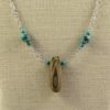 Collier en bois flotté et turquoises